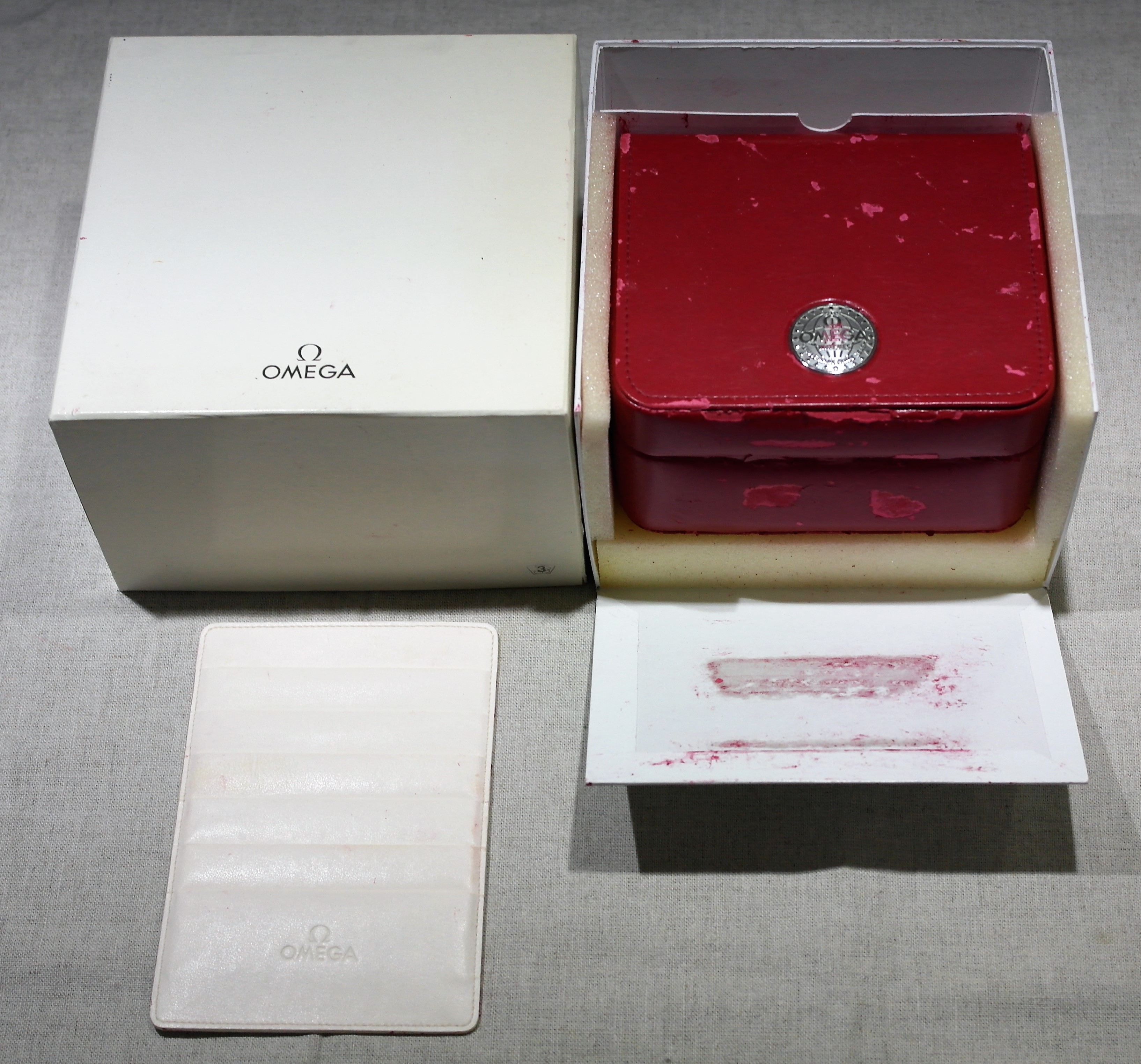Omega vintage watch red box for speedmaster models and leather wallet in used condition | San Giorgio a Cremano