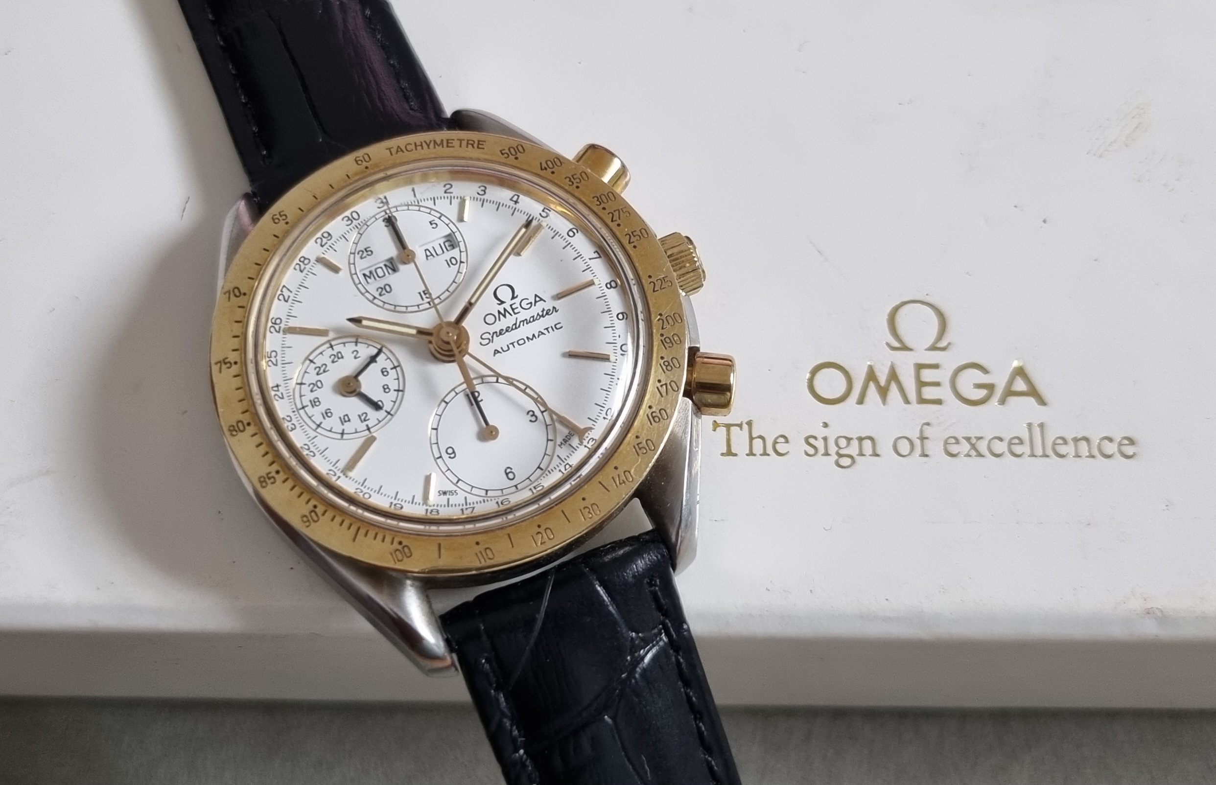 Omega Speedmaster Speedmaster Date triple date chronograph automatic mm 39 steel and 18 kt yellow gold bezel box | San Giorgio a Cremano