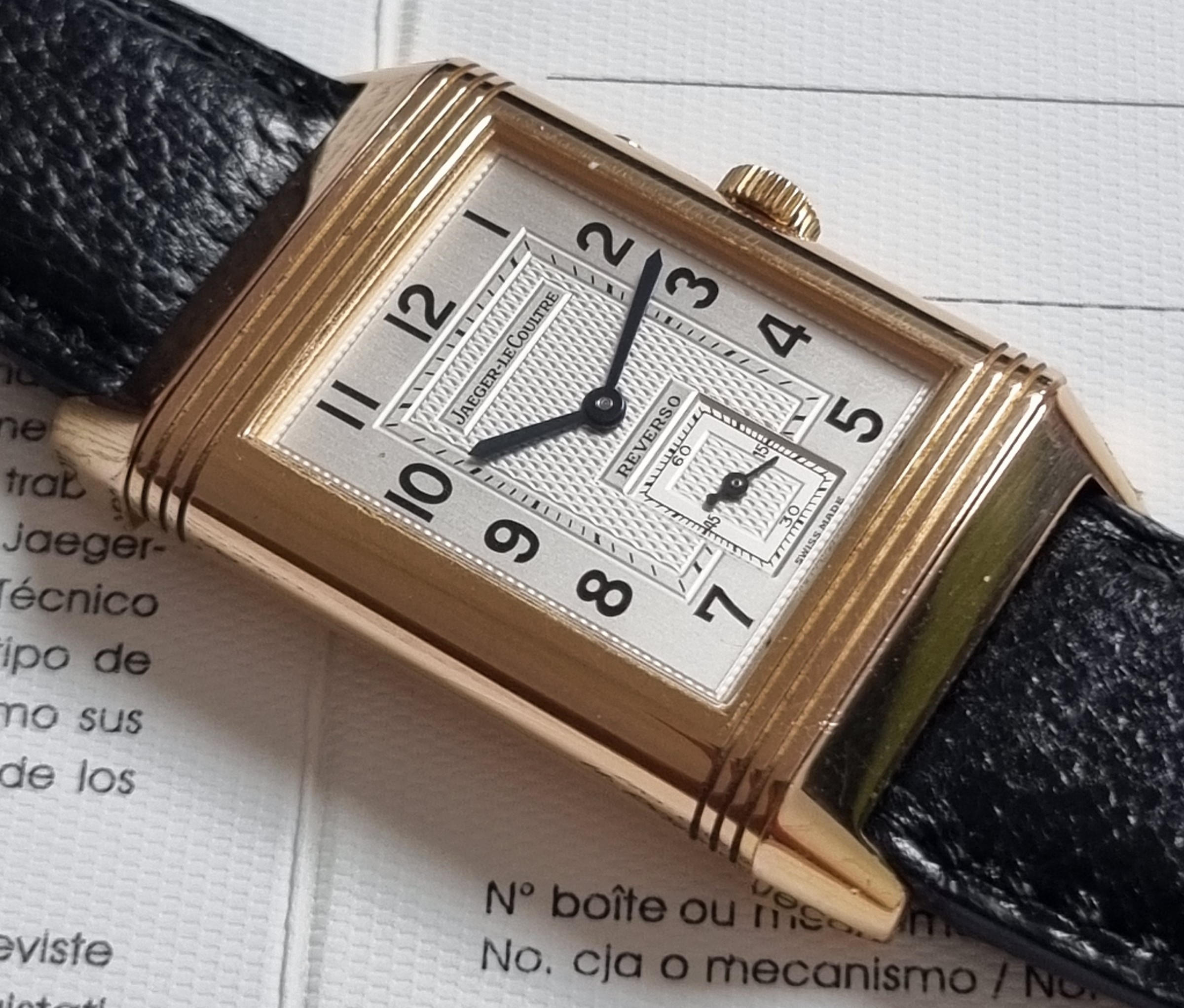 Jaeger-LeCoultre Reverso Duoface Jaeger-LeCoultre. An 18k Pink Gold Reversible Double-Dialed Wristwatch with Second Time Zone and 24-Hour Display.Signed Jaeger-LeCoultre, Reverso Duoface Day-Night, Ref. 270.2.54 , Circa 2000.Mechanical jewelled movement, silvered guilloché dial with black Arabic numerals on a polished chapter ring, subsidiary dial for constant seconds, the reverse with a charcoal guilloché dial, luminous Arabic and applied dagger numerals on a blank chapter ring, luminous hands, subsidiary dial for 24 hour indication, rectangular case, ridged edges, all pivoting within the plain backplate, 18k pink gold Jaeger-LeCoultre deployant clasp, case, dial, and movement signed.42mm overall length. Box and paper Jaeger-Lecoultre as pics. Genaral condition good as pics - scratches as pics.